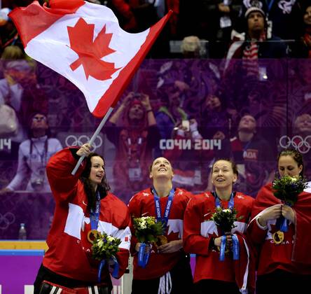 Feb. 20, 2014 - Sochi - Team Canada goalie Shannon Szabados of Edmonton, AB., waves a Canadain flag as players celebrated after beating Team USA 3-2 in overtime to win the women s ice hockey gold medal at the Bolshoy Ice Dome at the Sochi 2014 Winter Olympics in Sochi, on Thursday Feb. 20, 2014. Al Charest Calgary Sun QMI Agency OLY2014 Team Canada vs Team USA in the women s ice hockey gold medal game at the Bolshoy Ice Dome during the Sochi 2014 Winter Olympics - ZUMAq06