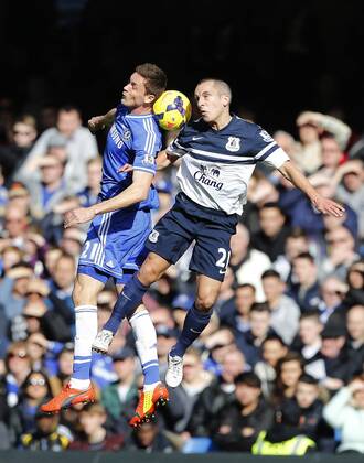 Chelsea s Nemanja Matic tussles with Everton s Leon Osman Chelsea vs Everton - Premier League - Stamford Bridge - London - England - 22 02 2014 - Pic David Klein Sportimage EDITORIAL USE ONLY. No use with unauthorised audio, video, data, fixture lists, club league logos or live services. Online in-match use limited to 120 images, no video emulation. No use in betting, games or single club league player publications.