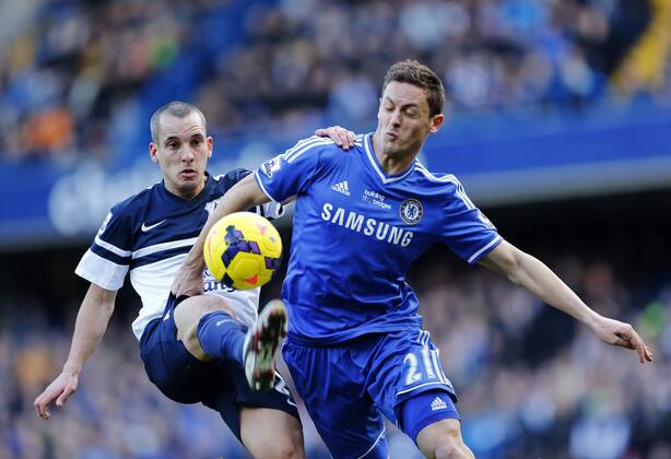 Chelsea s Nemanja Matic tussles with Everton s Leon Osman Chelsea vs Everton - Premier League - Stamford Bridge - London - England - 22 02 2014 - Pic David Klein Sportimage EDITORIAL USE ONLY. No use with unauthorised audio, video, data, fixture lists, club league logos or live services. Online in-match use limited to 120 images, no video emulation. No use in betting, games or single club league player publications.