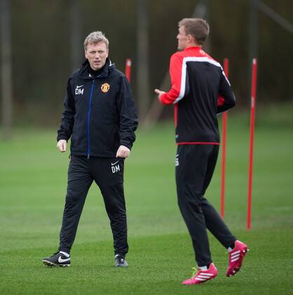 David Moyes, manager of Manchester United talks to Darren Fletcher about the Euro 2016 draw and Scotland s chances - Manchester United Training - UEFA Champions League - Aon Training Complex - Carrington, Manchester - England - 24th February 2014 - Picture Philip Oldham Sportimage EDITORIAL USE ONLY. No use with unauthorised audio, video, data, fixture lists, club league logos or live services. Online in-match use limited to 120 images, no video emulation. No use in betting, games or single club league player publications.