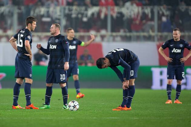 Manchester United look dejected following the opening goal - UEFA Champions League First Knockout Round - Olympiacos vs. Manchester United - Karaiskakh Stadium - Athens - Greece - 25th February 2014 - EDITORIAL USE ONLY. No use with unauthorised audio, video, data, fixture lists, club league logos or live services. Online in-match use limited to 120 images, no video emulation. No use in betting, games or single club league player publications.
