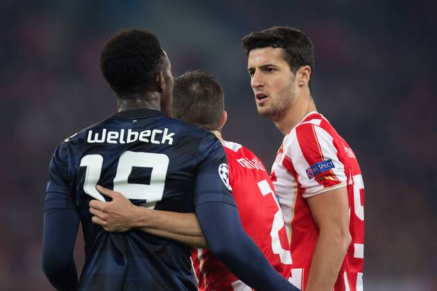 Ivan Marcano of Olympiacos and Danny Welbeck of Manchester United clash - UEFA Champions League First Knockout Round - Olympiacos vs. Manchester United - Karaiskakh Stadium - Athens - Greece - 25th February 2014 - EDITORIAL USE ONLY. No use with unauthorised audio, video, data, fixture lists, club league logos or live services. Online in-match use limited to 120 images, no video emulation. No use in betting, games or single club league player publications.