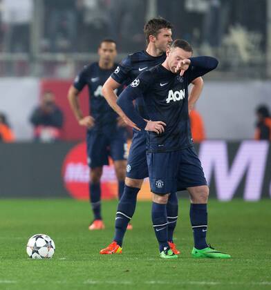Manchester United are left looking dejected following the second goal - UEFA Champions League First Knockout Round - Olympiacos vs. Manchester United - Karaiskakh Stadium - Athens - Greece - 25th February 2014 - Picture Philip Oldham Sportimage EDITORIAL USE ONLY. No use with unauthorised audio, video, data, fixture lists, club league logos or live services. Online in-match use limited to 120 images, no video emulation. No use in betting, games or single club league player publications.