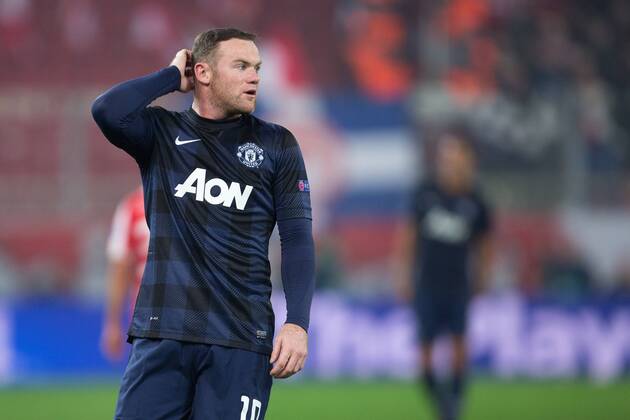 Wayne Rooney of Manchester United scratches his head - UEFA Champions League First Knockout Round - Olympiacos vs. Manchester United - Karaiskakh Stadium - Athens - Greece - 25th February 2014 - Picture Philip Oldham Sportimage EDITORIAL USE ONLY. No use with unauthorised audio, video, data, fixture lists, club league logos or live services. Online in-match use limited to 120 images, no video emulation. No use in betting, games or single club league player publications.