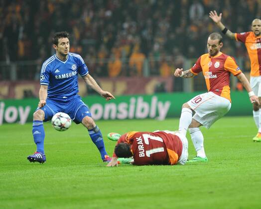 UEFA Champions League Round of 16 first leg match between Galatasaray AS and Chelsea at Turk Telekom Arena on February 26, 2014 in Istanbul, Turkey. Pictured: Frank Lampard of Chelsea and Burak Yilmaz and Wesley Sneijder of Galatasaray. 