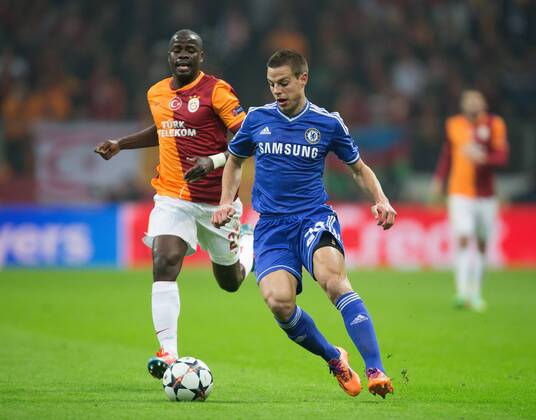 Cesar Azpilicueta of Chelsea escapes Aurelien Chedjou of Galatasaray - UEFA Champions League First Knockout Round - Galatasaray S.K vs. Chelsea - Turk Telekom Arena - Istanbul - Turkey - 26th February 2014 - Picture Philip Oldham Sportimage EDITORIAL USE ONLY. No use with unauthorised audio, video, data, fixture lists, club league logos or live services. Online in-match use limited to 120 images, no video emulation. No use in betting, games or single club league player publications.