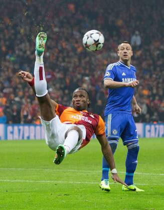 Didier Drogba of Galatasaray clears with an overhead kick - UEFA Champions League First Knockout Round - Galatasaray S.K vs. Chelsea - Turk Telekom Arena - Istanbul - Turkey - 26th February 2014 - Picture Philip Oldham Sportimage EDITORIAL USE ONLY. No use with unauthorised audio, video, data, fixture lists, club league logos or live services. Online in-match use limited to 120 images, no video emulation. No use in betting, games or single club league player publications.