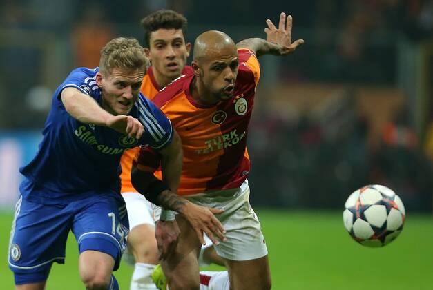 UEFA Champions League Round of 16 first leg match between Galatasaray AS and Chelsea at Turk Telekom Arena on February 26, 2014 in Istanbul, Turkey. Pictured: Schurrle of Chelsea and Felipe Melo of Galatasaray. 