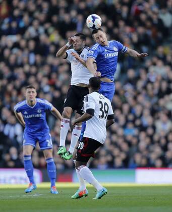 Fulham s Clint Dempsey tussles with Chelsea s John Terry Fulham FC vs Chelsea FC London - Premier League - Craven Cottage - London - England - 01 03 2014 - EDITORIAL USE ONLY. No use with unauthorised audio, video, data, fixture lists, club league logos or live services. Online in-match use limited to 120 images, no video emulation. No use in betting, games or single club league player publications.