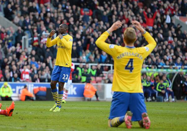 Yaya Sanogo of Arsenal hides his face after missing a last minute chance to score - Barclays Premier League - Stoke City vs Arsenal FC London - Britannia Stadium - Stoke - England - 29th February 2014 - EDITORIAL USE ONLY. No use with unauthorised audio, video, data, fixture lists, club league logos or live services. Online in-match use limited to 120 images, no video emulation. No use in betting, games or single club league player publications.