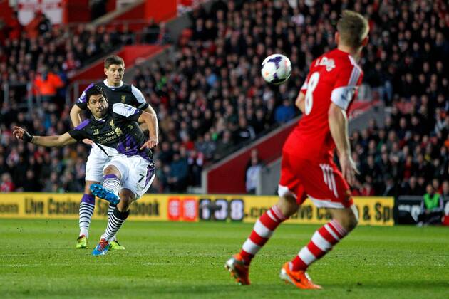 Football - 2013 2014 Premier League - FC Southampton vs. FC Liverpool Luis Suarez of Liverpool curls a free kick over the cross bar at St Mary s Stadium Southampton 
