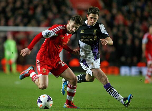 Football - 2013 2014 Premier League - FC Southampton vs. FC Liverpool Southampton s Adam Lallana holds off Joe Allen of Liverpool at St Mary s Stadium Southampton 