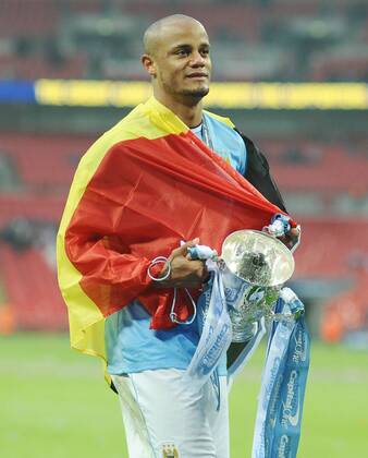 Football - 2014 Capital One League Cup Final - Manchester City vs. AFC Sunderland FC - City s Vincent Kompany celebrates with the trophy at Wembley. 