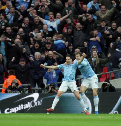 Capital One Cup Final - Manchester City v Sunderland . . Wembley, London, UK . . 02.03.2014 Samir Nasri (MC) celebrates scoring the second City goal with Edin Dzeko (MC). 