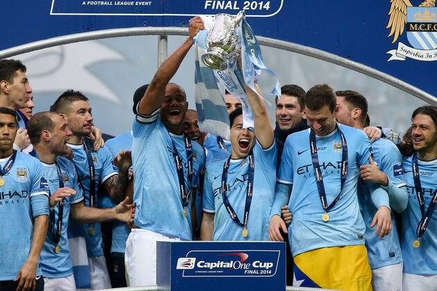 Manchester City s Vincent Kompany lifts the trophy with man of the match Samir Nasri - Manchester City vs AFC Sunderland FC - League Cup Final - Wembley Stadium - London - 2nd March 2014 - EDITORIAL USE ONLY. No use with unauthorised audio, video, data, fixture lists, club league logos or live services. Online in-match use limited to 120 images, no video emulation. No use in betting, games or single club league player publications.