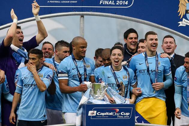 Manchester City s Vincent Kompany lifts the trophy with man of the match Samir Nasri - Manchester City vs AFC Sunderland FC - League Cup Final - Wembley Stadium - London - 2nd March 2014 - EDITORIAL USE ONLY. No use with unauthorised audio, video, data, fixture lists, club league logos or live services. Online in-match use limited to 120 images, no video emulation. No use in betting, games or single club league player publications.