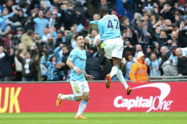 Manchester City s Yaya Toure celebrates his goal - Manchester City vs Sunderland - League Cup Final - Wembley Stadium - London - 2nd March 2014 - Pic Charlie Forgham-Bailey Sportimage EDITORIAL USE ONLY. No use with unauthorised audio, video, data, fixture lists, club league logos or live services. Online in-match use limited to 120 images, no video emulation. No use in betting, games or single club league player publications.