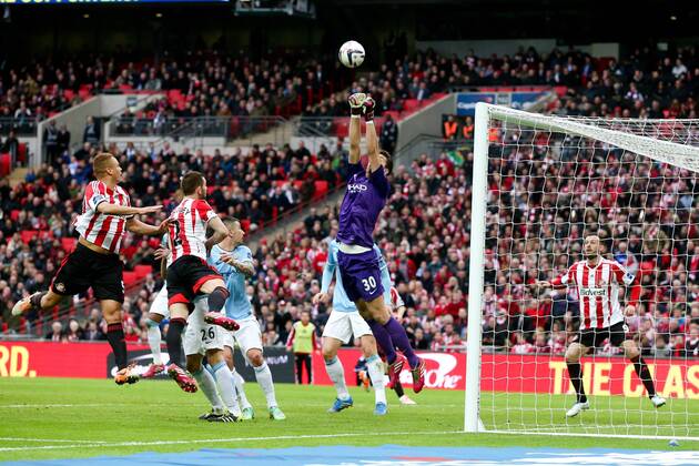 Manchester City s Costel Pantilimon makes an athletic save - Manchester City vs Sunderland - League Cup Final - Wembley Stadium - London - 2nd March 2014 - Pic Charlie Forgham-Bailey Sportimage EDITORIAL USE ONLY. No use with unauthorised audio, video, data, fixture lists, club league logos or live services. Online in-match use limited to 120 images, no video emulation. No use in betting, games or single club league player publications.