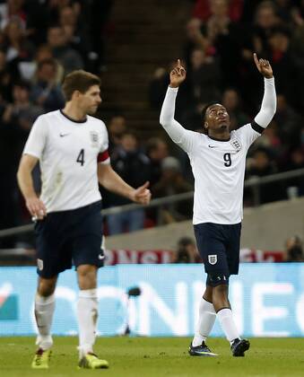 (140306) -- LONDON, March 6, 2014 (Xinhua) -- Daniel Sturridge(R) of England celebrates scoring during an international friendly soccer match between England and Denmark at Wembley Stadium in London, Britain on March 5, 2014. England won 1-0.(Xinhua Wang Lili) (SP)BRITAIN-LONDON-SOCCER-INTERNATIONAL FRIENDLY-ENG VS DEN 