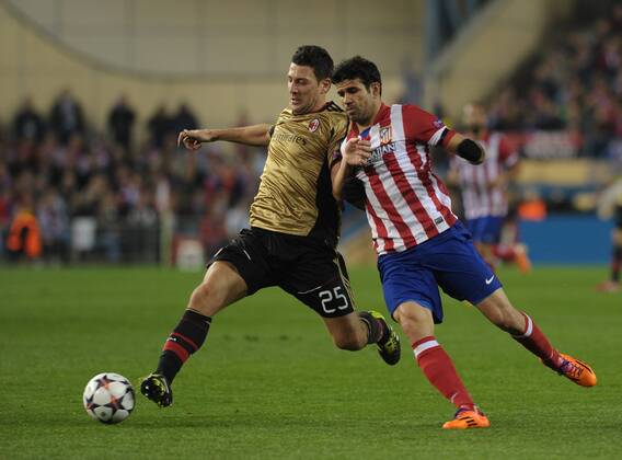 AC Milan Defender, number 25 DANIELE BONERA - Daniele Bonera (31), Atletico de Madrid Forward, number 19 DIEGO COSTA - Diego da Silva Costa (24) during round Round of 16 of the UEFA CHAMPIONS league, soccer match between Atletico de Madrid - AC Milan at the VicentexCalderon estadium, Madrid - Spain by March 11, 2014. 
