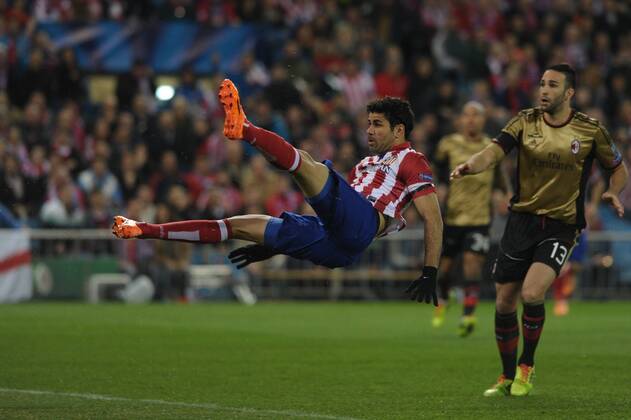 Atletico de Madrid Forward, number 19 DIEGO COSTA - Diego da Silva Costa (24), celebrates after scoring a goal (1-0)AC Milan Defender, number 13 ADIL RAMI - Adil Rami (27) during round Round of 16 of the UEFA CHAMPIONS league, soccer match between Atletico de Madrid - AC Milan at the VicentexCalderon estadium, Madrid - Spain by March 11, 2014. 