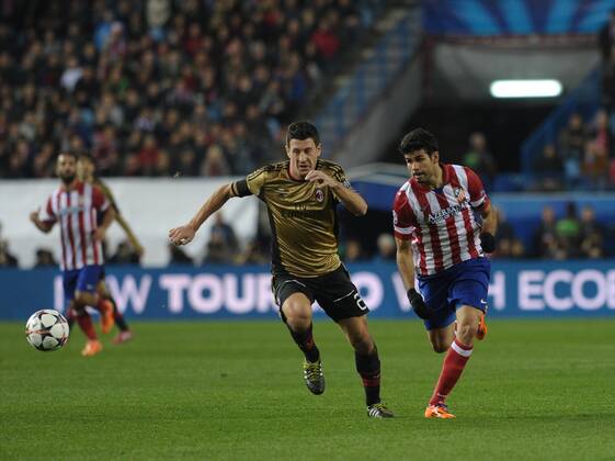 AC Milan Defender, number 25 DANIELE BONERA - Daniele Bonera (31), Atletico de Madrid Forward, number 19 DIEGO COSTA - Diego da Silva Costa (24) during round Round of 16 of the UEFA CHAMPIONS league, soccer match between Atletico de Madrid - AC Milan at the VicentexCalderon estadium, Madrid - Spain by March 11, 2014. 
