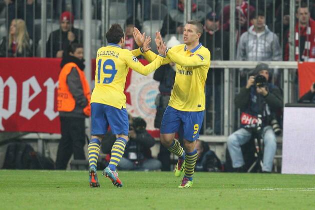l-r: Torjubel von Santi CAZORLA 19 (FC Arsenal London) und Lukas PODOLSKI 9 (FC Arsenal London) FC Bayern München vs. Arsenal London, Fussball, Champions League, 11.03.2014 EP_ckt