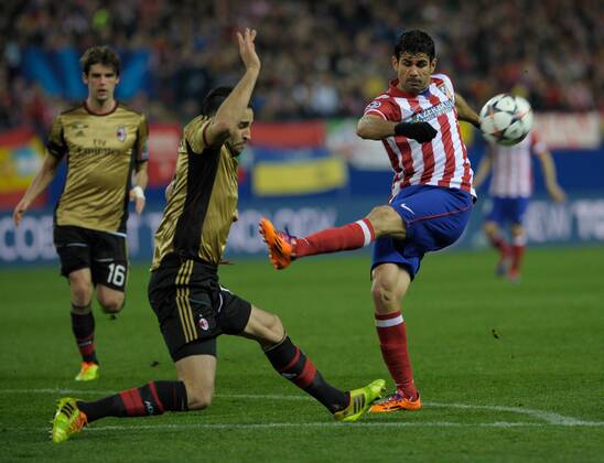 Atletico de Madrid Forward, number 19 DIEGO COSTA - Diego da Silva Costa (24), AC Milan Defender, number 13 ADIL RAMI - Adil Rami (27) during round Round of 16 of the UEFA Champions league, soccer match between Atletico de Madrid - AC Milan at the VicentexCalderon estadium, Madrid - Spain by March 11, 2014. 