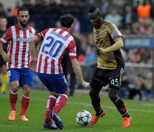 Atletico de Madrid Defender, number 20 JUANFRAN - Juan Francisco Torres Belen (27), AC Milan Forward, number 45 MARIO BALOTELLI - Mario Balotelli (22) during round Round of 16 of the UEFA Champions league, soccer match between Atletico de Madrid - AC Milan at the VicentexCalderon estadium, Madrid - Spain by March 11, 2014. 
