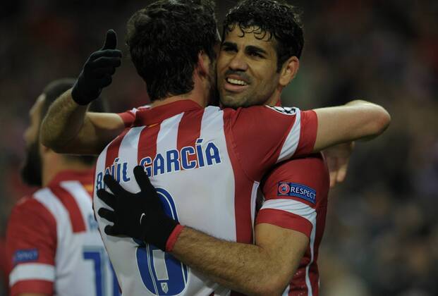 Atletico de Madrid Midfielder, number 8 RAUL GARCIA - Raul Garcia Escudero (26), celebrates after scoring a goal (3-1) during round Round of 16 of the UEFA Champions league, soccer match between Atletico de Madrid - AC Milan at the VicentexCalderon estadium, Madrid - Spain by March 11, 2014. 