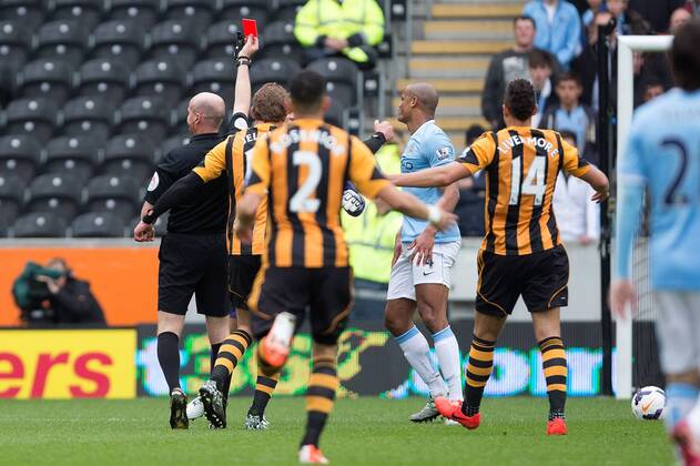 Vincent Kompany of Manchester City is shown a straight red card - Barclays Premier League - Hull vs. Manchester City - KC Stadium - Hull - England - 15th March 2014 - Picture Philip Oldham Sportimage EDITORIAL USE ONLY. No use with unauthorised audio, video, data, fixture lists, club league logos or live services. Online in-match use limited to 120 images, no video emulation. No use in betting, games or single club league player publications.