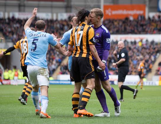 Joe Hart of Manchester City and Hull s George Boyd come to blows following a penalty appeal - Barclays Premier League - Hull vs. Manchester City - KC Stadium - Hull - England - 15th March 2014 - Picture Philip Oldham Sportimage EDITORIAL USE ONLY. No use with unauthorised audio, video, data, fixture lists, club league logos or live services. Online in-match use limited to 120 images, no video emulation. No use in betting, games or single club league player publications.