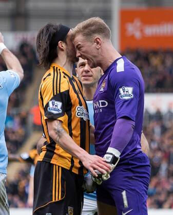 Joe Hart of Manchester City and Hull s George Boyd come to blows following a penalty appeal - Barclays Premier League - Hull vs. Manchester City - KC Stadium - Hull - England - 15th March 2014 - Picture Philip Oldham Sportimage EDITORIAL USE ONLY. No use with unauthorised audio, video, data, fixture lists, club league logos or live services. Online in-match use limited to 120 images, no video emulation. No use in betting, games or single club league player publications.