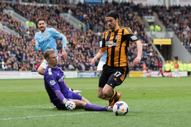 Hull s George Boyd goes down over the outstretched leg of Joe Hart of Manchester City but is refused a penalty - Barclays Premier League - Hull vs. Manchester City - KC Stadium - Hull - England - 15th March 2014 - Picture Philip Oldham Sportimage EDITORIAL USE ONLY. No use with unauthorised audio, video, data, fixture lists, club league logos or live services. Online in-match use limited to 120 images, no video emulation. No use in betting, games or single club league player publications.