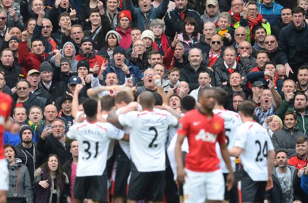 Steven Gerrard of Liverpool celebrates his goal in front of the Stretford End - Barclays Premier League - Manchester Utd vs Liverpool - Old Trafford Stadium - Manchester - England - 16th March 2014 - Pic Simon Bellis Sportimage EDITORIAL USE ONLY. No use with unauthorised audio, video, data, fixture lists, club league logos or live services. Online in-match use limited to 120 images, no video emulation. No use in betting, games or single club league player publications.