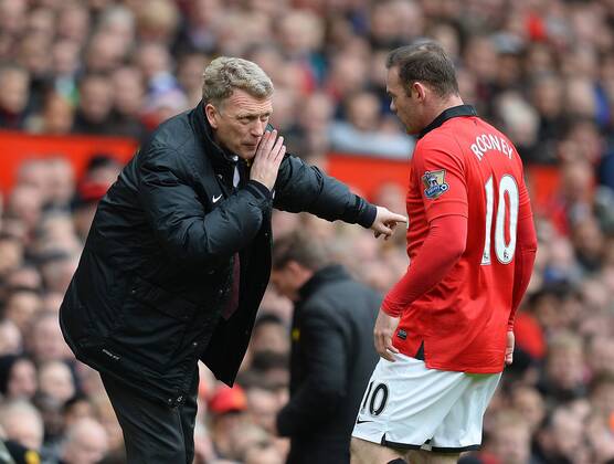 David Moyes manager of Manchester United talks to Wayne Rooney of Manchester United - Barclays Premier League - Manchester Utd vs Liverpool - Old Trafford Stadium - Manchester - England - 16th March 2014 - Pic Simon Bellis Sportimage EDITORIAL USE ONLY. No use with unauthorised audio, video, data, fixture lists, club league logos or live services. Online in-match use limited to 120 images, no video emulation. No use in betting, games or single club league player publications.