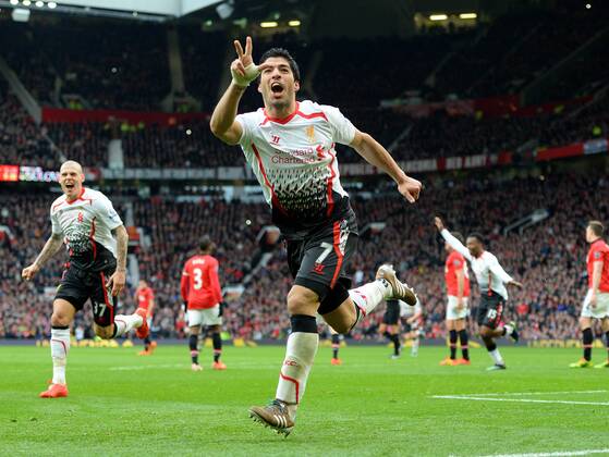Luis Suarez of Liverpool celebrates scoring the third goal - Barclays Premier League - Manchester Utd vs Liverpool - Old Trafford Stadium - Manchester - England - 16th March 2014 - Pic Simon Bellis Sportimage EDITORIAL USE ONLY. No use with unauthorised audio, video, data, fixture lists, club league logos or live services. Online in-match use limited to 120 images, no video emulation. No use in betting, games or single club league player publications.