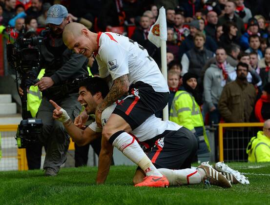 Luis Suarez of Liverpool celebrates scoring the third goal - Barclays Premier League - Manchester Utd vs Liverpool - Old Trafford Stadium - Manchester - England - 16th March 2014 - Pic Simon Bellis Sportimage EDITORIAL USE ONLY. No use with unauthorised audio, video, data, fixture lists, club league logos or live services. Online in-match use limited to 120 images, no video emulation. No use in betting, games or single club league player publications.