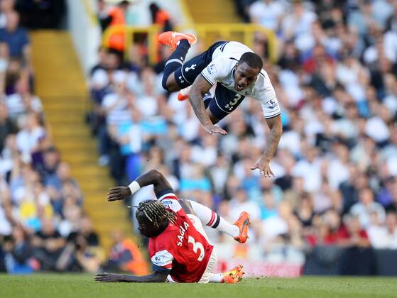Arsenal s Bacary Sagna gets booked for this tackle on Tottenham s Danny Rose Tottenham Hotspur v Arsenal FC - Premier League - White Hart Lane - London - England - 16 03 2014 - EDITORIAL USE ONLY. No use with unauthorised audio, video, data, fixture lists, club league logos or live services. Online in-match use limited to 120 images, no video emulation. No use in betting, games or single club league player publications.