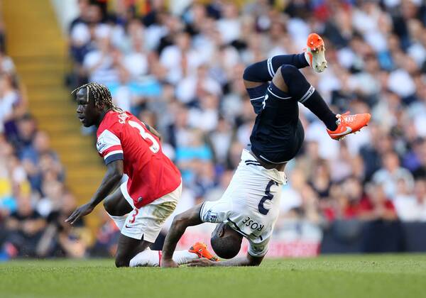 Arsenal s Bacary Sagna gets booked for this tackle on Tottenham s Danny Rose Tottenham Hotspur v Arsenal FC - Premier League - White Hart Lane - London - England - 16 03 2014 - EDITORIAL USE ONLY. No use with unauthorised audio, video, data, fixture lists, club league logos or live services. Online in-match use limited to 120 images, no video emulation. No use in betting, games or single club league player publications.