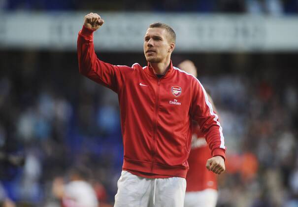 Football - 2013 2014 Premier League Tottenham Hotspur vs FC Arsenal Arsenal s Lukas Podolski celebrates at the final whistle at White Hart Lane. 