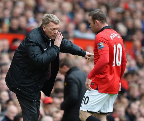 David Moyes manager of Manchester United talks to Wayne Rooney of Manchester United - Barclays Premier League - Manchester Utd vs Liverpool - Old Trafford Stadium - Manchester - England - 16th March 2014 - Pic Simon Bellis Sportimage EDITORIAL USE ONLY. No use with unauthorised audio, video, data, fixture lists, club league logos or live services. Online in-match use limited to 120 images, no video emulation. No use in betting, games or single club league player publications.