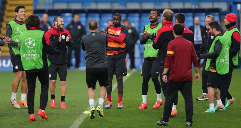 Yekta Kurtulus (L), Emmanuel Eboue (C) and Aurelien Chadjou (R) of Galatasaray in action during a Galatasaray AS training session at Stamford Bridge on March 17, 2014 in London, England. 