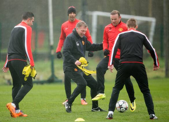 David Moyes, manager of Manchester United and Wayne Rooney in action - UEFA Champions League - Manchester United Training - Aon Carrington Training Complex - Manchester - England - 18th March 2014 - Picture Philip Oldham Sportimage EDITORIAL USE ONLY. No use with unauthorised audio, video, data, fixture lists, club league logos or live services. Online in-match use limited to 120 images, no video emulation. No use in betting, games or single club league player publications.