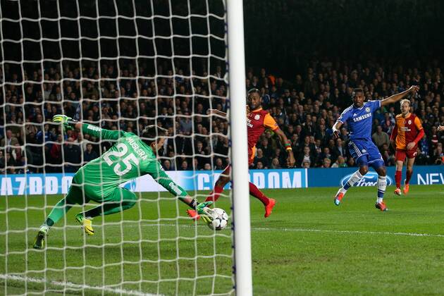 Samuel Eto o of Chelsea scoring the opening goal - Chelsea vs Galatasaray - Champions League Round of 16 Second Leg - Stamford Bridge Stadium - London - 18th March 2014 - Pic Charlie Forgham-Bailey Sportimage EDITORIAL USE ONLY. No use with unauthorised audio, video, data, fixture lists, club league logos or live services. Online in-match use limited to 120 images, no video emulation. No use in betting, games or single club league player publications.