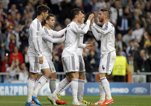 Real Madrid - FC Schalke 04 of the Champions League, held at the Santiago Bernabeu stadium, in Madrid 03 18 2014. Real Madrid s players celebrate with Cristiano Ronaldo 