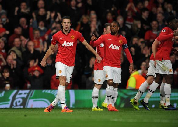 Robin van Persie of Manchester United celebrates scoring his hat trick at Old Trafford, ManchesterFootball - 2013 2014 Champions League - Round of Sixteen, Second Leg: Manchester United vs. Olympiakos