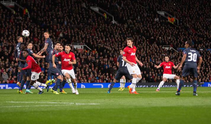Robin van Persie of Manchester United scores his third goal - UEFA Champions League Round of 16 - Manchester United vs. Olympiacos - Old Trafford - Manchester - England - 19th March 2014 - Picture Philip Oldham Sportimage EDITORIAL USE ONLY. No use with unauthorised audio, video, data, fixture lists, club league logos or live services. Online in-match use limited to 120 images, no video emulation. No use in betting, games or single club league player publications.