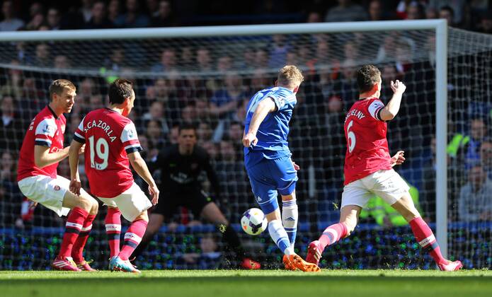Chelsea s Andre Schurrle scoring his sides second goal Chelsea vs Arsenal - Premier League - Stamford Bridge - London - England - 22 03 2014 - Pic David Klein Sportimage EDITORIAL USE ONLY. No use with unauthorised audio, video, data, fixture lists, club league logos or live services. Online in-match use limited to 120 images, no video emulation. No use in betting, games or single club league player publications.