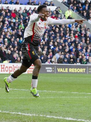 Football - 2013 2014 Premier League - Cardiff City vs. Liverpool Daniel Sturridge of Liverpool celebrates scoring Liverpool s 5th at the Cardiff City Stadium. COLORSPORT WINSTON BYNORTH 